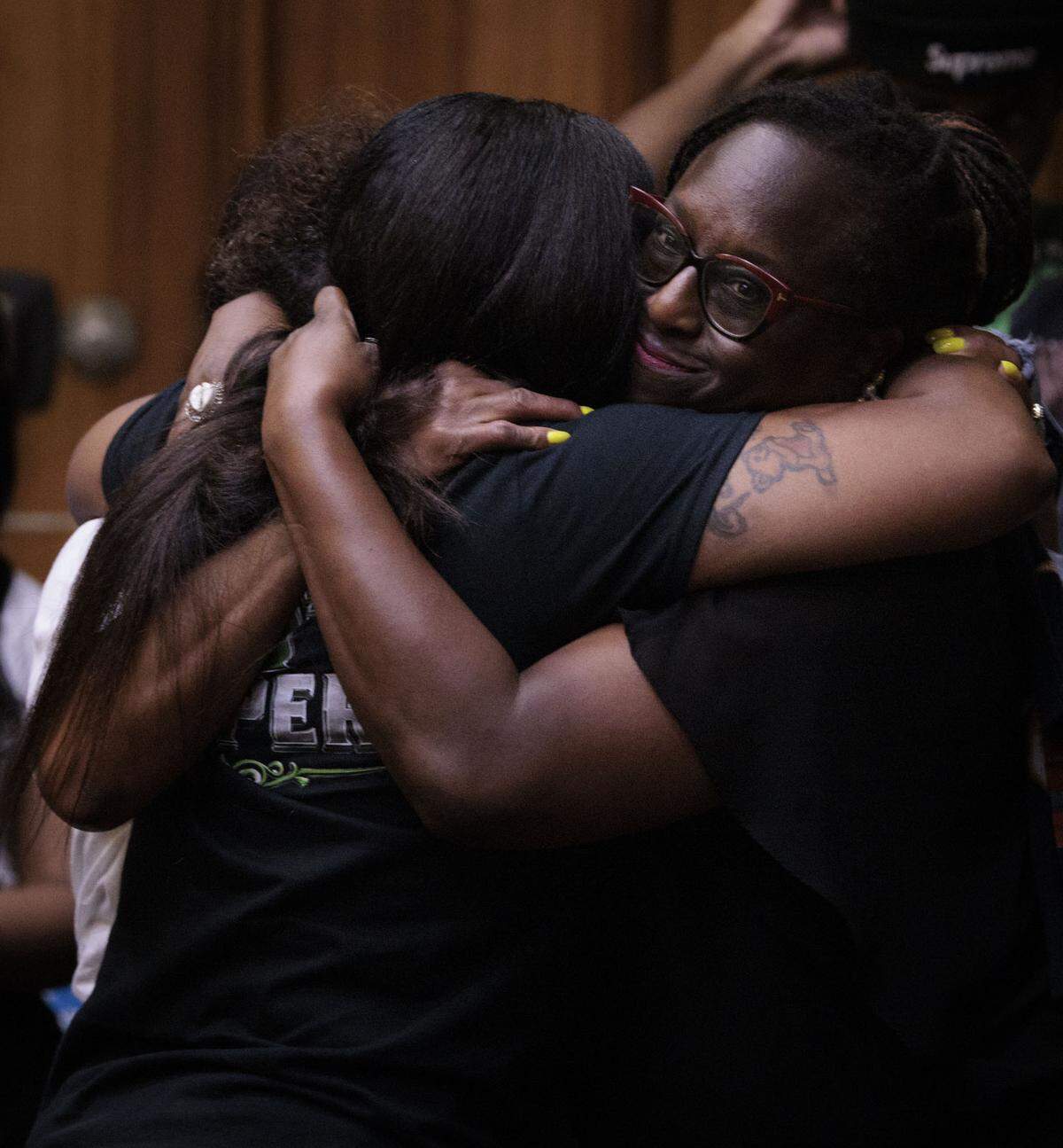 Melba Pearson, the Lollar family’s attorney, right, hugs Nathalie Jean, left, the mother of Yahkeim Lollar, after Jahara Malik was sentenced to 17 years in prison on Tuesday, May 5, 2026, for killing Yahkeim.